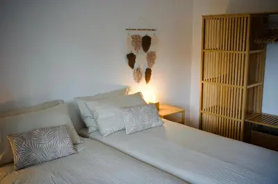 a bed with two pillows on it in a room at Villa Finch Mondello in Palermo