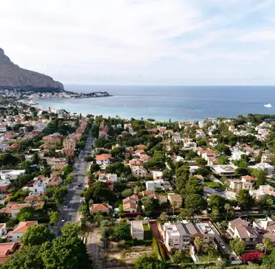 an aerial view of a city and the ocean at Villa Finch Mondello in Palermo