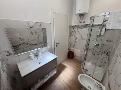a bathroom with a sink and a shower at Casa Donna Ina in Palermo
