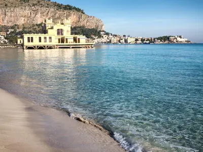 a house on the beach next to the water at Nuovo Basile by Holiday World in Palermo