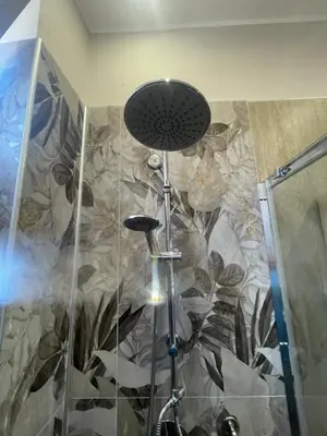 a bathroom with a sink and a mirror and a toilet at La casetta del sole in Palermo
