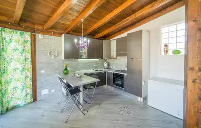 a kitchen with a table and chairs in a room at Gorgeous Home In Trabia in Trabia
