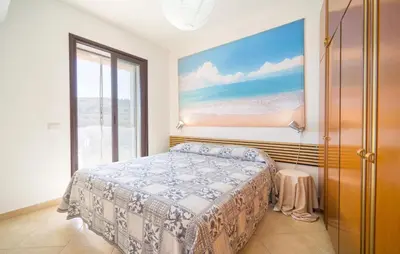 a bedroom with a bed and a large window at Gorgeous Home In Trabia in Trabia