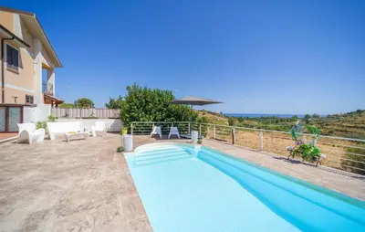 a swimming pool in the backyard of a house at Gorgeous Home In Trabia in Trabia