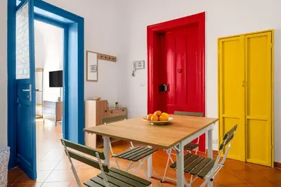 a dining room with a table with a bowl of fruit on it at Elegant Two-Room Apartment with Balcony & Suite in Palermo