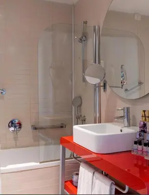 a bathroom with a white sink and a shower at Domina Zagarella multiproprietà MINIMO 6 NOTTI in Santa Flavia