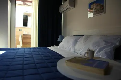 a bedroom with a bed and a table with a tray on it at Centro storico apartment & Loft - Amnesia Holiday Home in Palermo