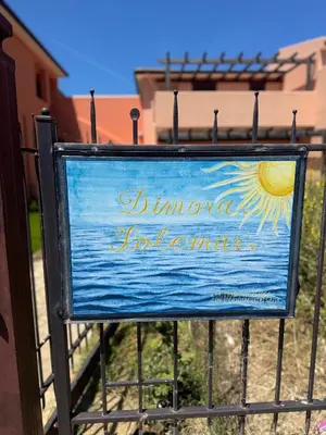 a sign that says dimona jones man at Dimora Solemar-Mareluna village in Campofelice di Roccella