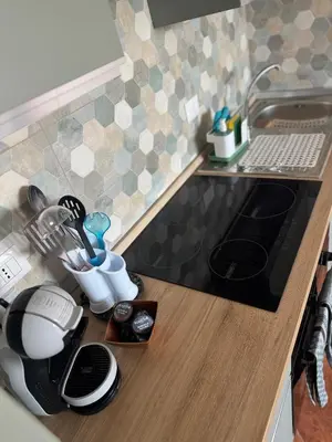 a kitchen counter top with a sink and a mixer at Dimora Solemar-Mareluna village in Campofelice di Roccella