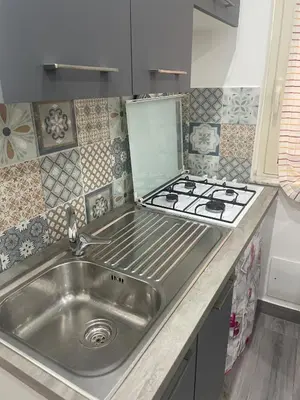 a kitchen with a sink and a stove at Altri tempi in Palermo