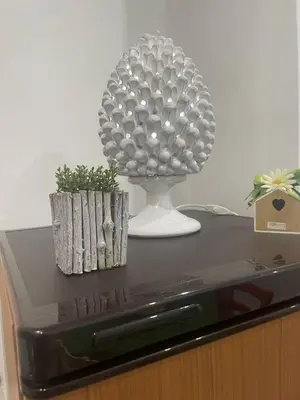 a table with a pineapple on top of a tv at Altri tempi in Palermo
