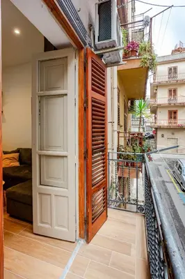 an open door to a balcony in a building at Casa Vacanza Dante 17 Carini in Carini