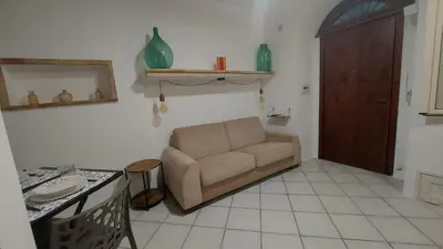 a living room with a couch and a table at Casa dei normanni in Palermo