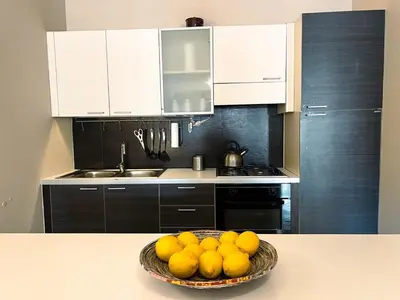 a bowl of fruit on a table in a kitchen at Belmonte 18 in Palermo