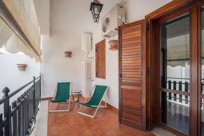 a bedroom with a bed with two towels on it at Le Sicilien - Villa Harmony - Relax a Mondello in Palermo