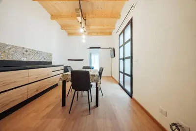 a dining room with a table and chairs at Casa Ru Vecchio Re in Palermo