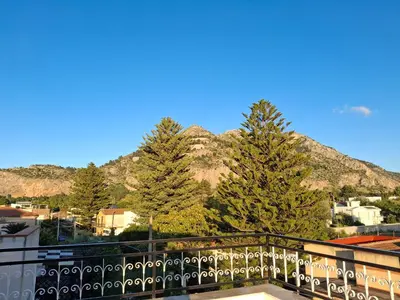 a view from the balcony of a house with trees at Mondello House29 in Palermo