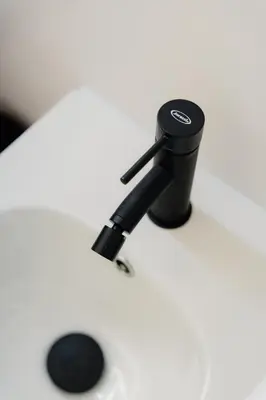 a black microphone sitting on top of a white table at Vincis Home in Palermo