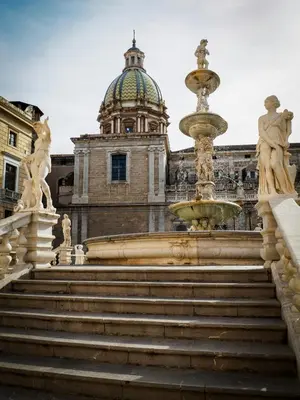 a view of a statue of an elephant between two columns at Easydoro Apartment in Palermo