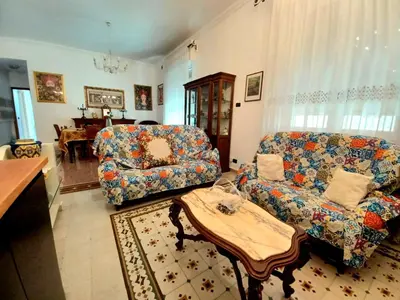 a living room with a couch and a table at House Via Napoli in Palermo