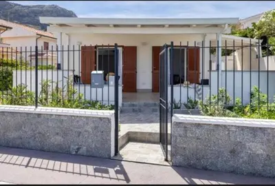 a gate in front of a house at la villetta sul mare in Palermo