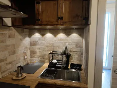 a kitchen with a sink and a counter top at La Casa Del Vecchio Borgo in Palermo