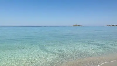 a heart drawn in the water on the beach at A Casa di Angela in Capaci
