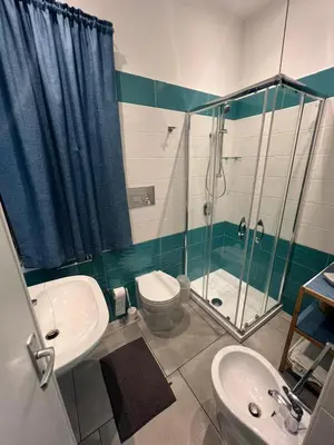 a bathroom with a shower and a toilet and a sink at Casa vacanza galatea San vito lo capo in San Vito lo Capo