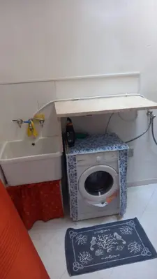 a small bathroom with a toilet and a sink at Casa vacanza galatea San vito lo capo in San Vito lo Capo