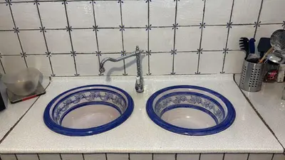two blue and white bowls sitting on a counter at Casa Vacanze Mazzini, amazing Rooftop! in Termini Imerese
