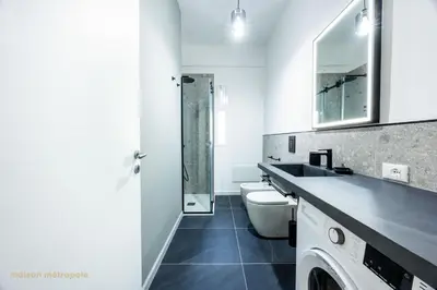 a white bathroom with a sink and a toilet at Calatafimi House in Palermo