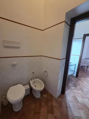 a bathroom with a toilet and a bidet at A Casa di Iside in Palermo