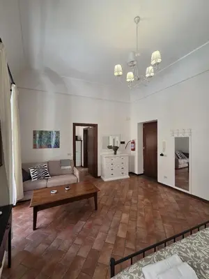 a living room with a couch and a coffee table at A Casa di Iside in Palermo