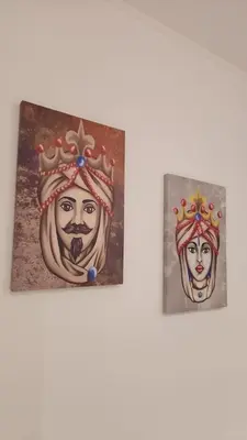 two paintings of a woman wearing a crown at La Corte Di San Basilio palermo in Palermo