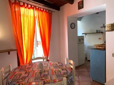 a dining room with a table and a window at Casa Ballarò Centro Storico in Palermo