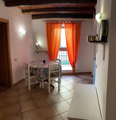a dining room with a table and a window at Casa Ballarò Centro Storico in Palermo