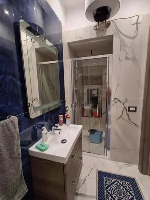 a bathroom with a sink and a shower at Stella Mare in Santa Flavia