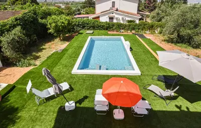 an overhead view of a yard with a swimming pool and an umbrella at Villa Anastasia in Partinico