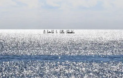 a group of sailboats in the ocean on the water at Villa Anastasia in Partinico