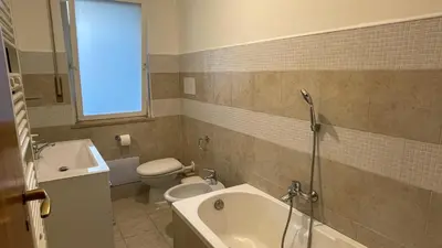 a bathroom with a tub and a toilet and a sink at Villafranca33 - Politeama Centro Palermo in Palermo