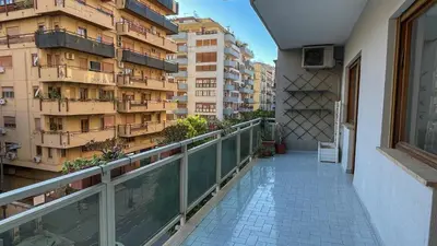 a balcony with a view of a building at Villafranca33 - Politeama Centro Palermo in Palermo