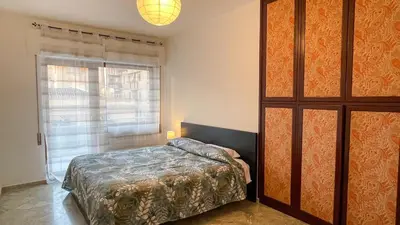 a bedroom with a bed and a large window at Villafranca33 - Politeama Centro Palermo in Palermo