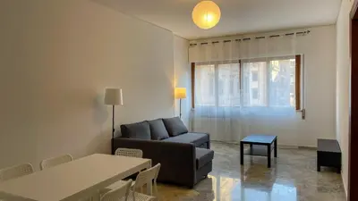a living room with a couch and a table at Villafranca33 - Politeama Centro Palermo in Palermo