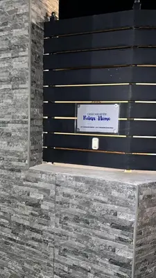 a bench with a sign that reads nixon time at Relax Home in Ficarazzi