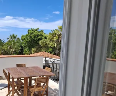 a table and chairs on a balcony with a view at Levriero1 in Carini