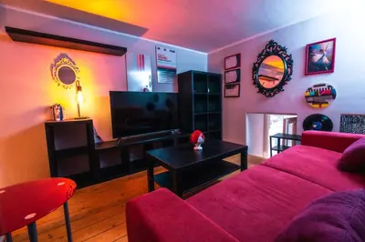 a living room with a couch and a table at Marta's Home in Palermo