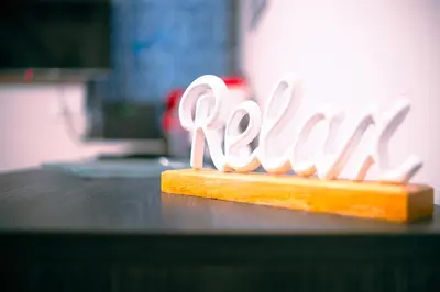 a sign for a restaurant on top of a counter at Marta's Home in Palermo