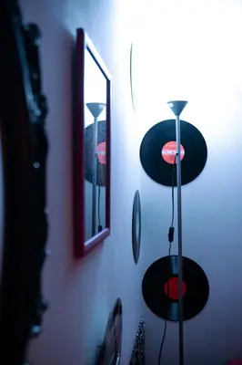 a room with cymbals on a wall with a mirror at Marta's Home in Palermo