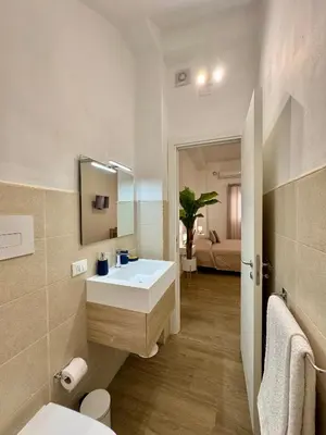 a bathroom with a sink and a mirror at TerrAmata in Terrasini