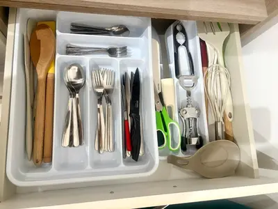 a drawer filled with utensils on a shelf at Suite 196 - Central City Palermo in Palermo